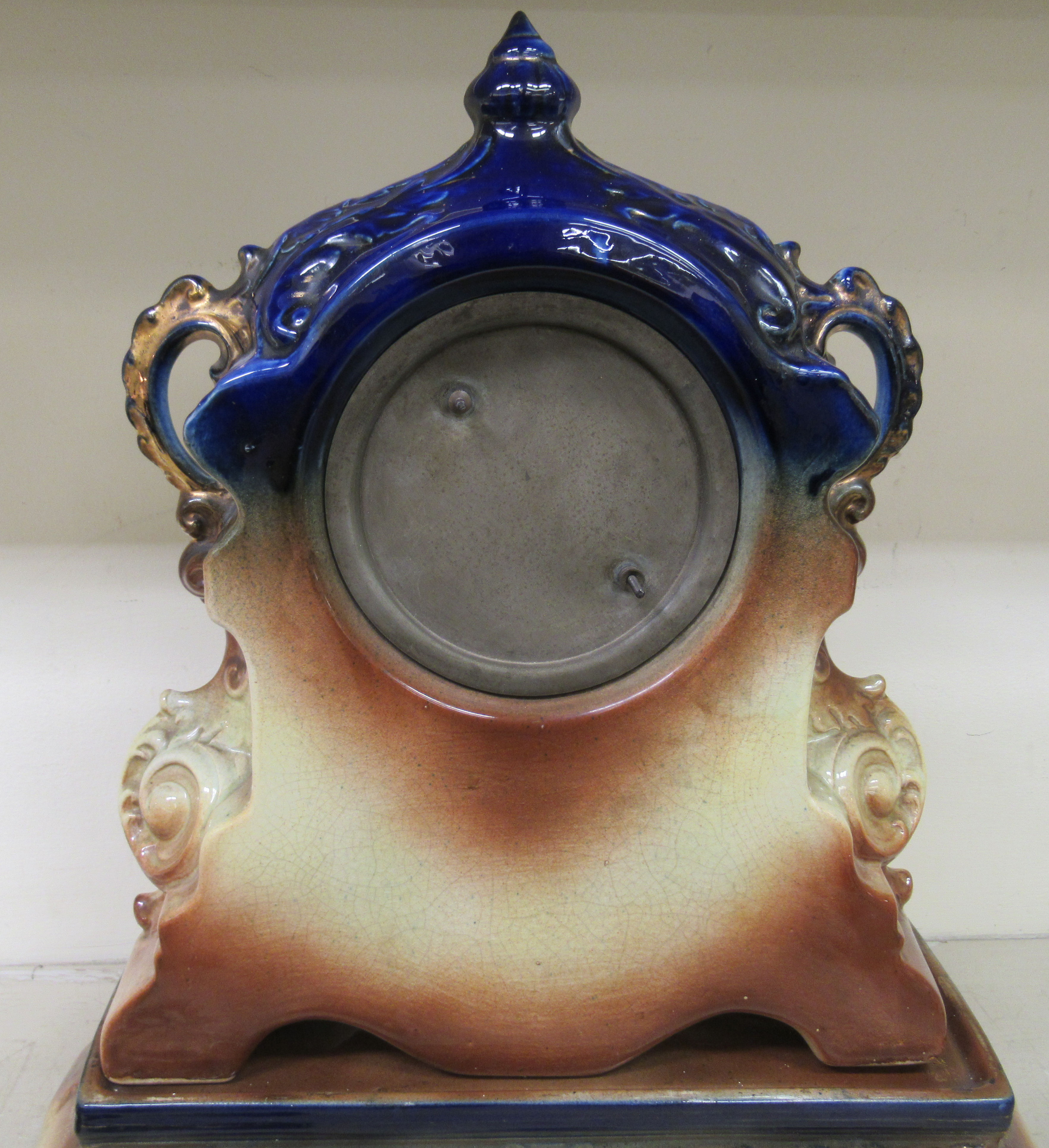 A late Victorian English china cased mantle clock; the movement faced by an Arabic dial, raised on - Image 4 of 8