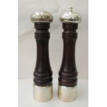 An Italian silver coloured metal mounted ring turned hardwood pepper mill  stamped Sterling; and a