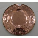 A Keswick School of Industrial Art, Arts & Crafts spot-hammered copper charger, having an applied