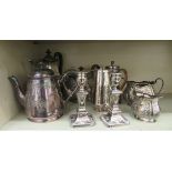 Silver plated tableware: to include a pair of loaded Edwardian candlesticks  6"h; and a four piece