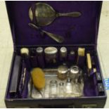 Early 20thC silver capped vanity items mixed marks; contained in a contemporary suitcase