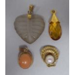 Four yellow metal variously set pendants