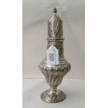 A Edwardian silver caster of pedestal vase design, decorated with embossed demi-reeded and stop-