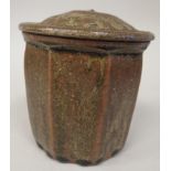 A Jim Malone studio pottery cannister with a lid  bearing printed initials & marks and capital A