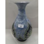 An early 20thC Royal Doulton stoneware bulbous bottle vase, having a narrow neck and flared rim,