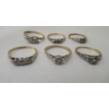 Six bi-coloured gold rings, set with small diamonds