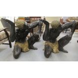 A pair of 20thC cast bronze blackamoor style figures of crouching men  28"h