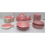 A Portuguese pink glazed china fish service with cabbage leaf design plates and bowls  largest 12"