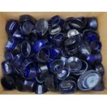 A quantity of mainly blue glass condiments pot liners of varying form