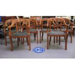 A set of six early 20thC light oak framed, bar back, open arm chair, the later stud upholstered