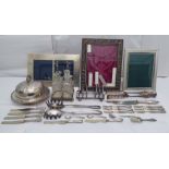 Silver plated tableware: to include a muffin dish; and a four piece cruet