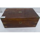 A late Victorian brass mounted rosewood writing slope with straight sides and a hinged lid,