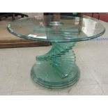 A modern glass occasional table, the top on a stepped, stair like column and a moulded plinth, on