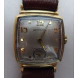 A 1940s Hamilton 9ct gold cased wristwatch, faced by an Arabic dial with subsidiary seconds, on a