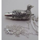 A Sterling silver novelty whistle, fashioned as a duck, on a fine neckchain