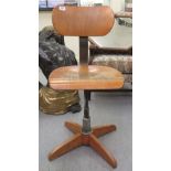 A mid 20thC industrially inspired, light oak finished and cast metal desk chair, on a swivel, sprung