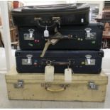 Four items of vintage and later, variously bound luggage