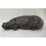 A 2001 Limited Edition 31/75 resin/bronze effect sculpture 'Hippo Sleeping'  bears a signature