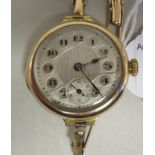 A lady's 9ct gold cased bracelet wristwatch, the Swiss movement faced by a silvered Arabic dial
