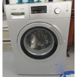 A Bosch Wash + Dry Exxcel 7/4, silver edition washer/dryer  33.5"h  23.5"w
