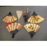 Hand fans, mainly Oriental, each decorated in unique designs