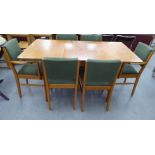 A Gordon Russell teak dining table, the two part top incorporating an additional leaf, raised on