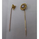 Two yellow metal stickpins, viz. one a foxes head, the other embellished in blue enamel, set with