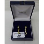 A pair of 9ct gold peridot and white stone pendant earrings
