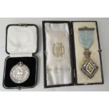 A silver Masonic medal; and an award for Hurdling  mixed marks