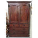 A mid 19thC mahogany linen press with a moulded cornice, over two panelled doors, the base with