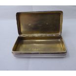 A George III silver snuff box with a hinged, ribbed body  London 1802