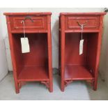 A pair of modern Chinese inspired red painted bedside chests, each with a single drawer, over an