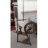 A late 20thC Victorian style oak and beech spinning wheel  60"h