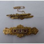 Two dissimilar Edwardian 9ct gold bar brooches, one set with red and white stones