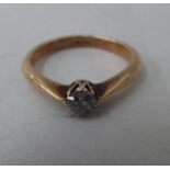 An 18ct gold diamond solitaire ring