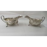 A pair of silver sauce boats, each with a wavy lip, on pad feet  Sheffield 1940