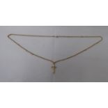 A 9ct gold pendant cross, on a 9ct gold belcher link chain