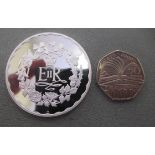 A Queen Elizabeth II Silver Jubilee medal  boxed with a certificate of authenticity; and a