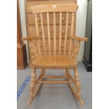 A modern pale beech and elm framed Windsor grandfather rocking chair with a lath back and level arms