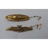 Two late Victorian/Edwardian 15ct gold bar brooches, variously set with seed pearls and coloured