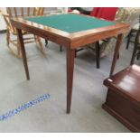 A modern Eastern fruitwood bridge table with a green baize top, raised on folding square, tapered