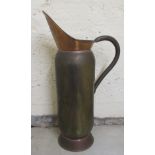 An early 20thC copper fireirons holder, fashioned as a ewer  29"h