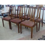 A set of six teak framed, twin splat back dining chairs, the fabric covered seats raised on