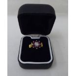 An 18ct gold diamond and ruby cluster ring