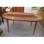 A 1960s teak extending dining table, raised on chamfered square legs  29"h  48"dia extending to 80"L