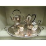 A silver plated twin handled serving tray, on talon and ball feet  31" x 18"; and a five piece