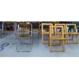 A set of four modern faux suede and tubular steel framed folding chairs; and a contemporary set of