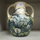A Moorcroft pottery twin handled vase, decorated with bulrushes and waterlilies  10.5"h