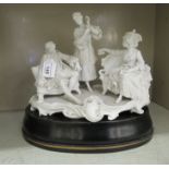 A European porcelain group, a salon scene with three figures wearing period costume, on a plinth