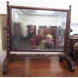 A Regency mahogany framed dressing table mirror, raised on turned, block supports, fan carved and
